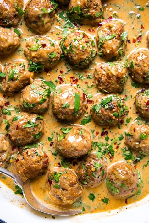 Herby, garlicky Thai meatballs simmered in a creamy red curry sauce are the “fusion” flavor bomb you didn’t know you needed. Jamaican Curry Turkey Meatballs, Low Carb Turkey Meatballs, Thai Turkey Meatballs, Thai Meatballs, Red Curry Sauce, The Modern Proper, Modern Proper, Turkey Meatball Recipe, Superbowl Snacks