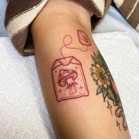 Cute mushroom tea bag #redinktattoo #redtattoo #mushroom #mushrooms🍄 #mushroomtattoo #tattoo #tattooartist #art #tea #teabag… | Instagram Patchwork, Ankle Tattoo Mushroom, Red Ink Mushroom Tattoo, Traditional Style Mushroom Tattoo, Mushroom Cow Tattoo, Minimal Tattoo Designs Unique, Mushroom Fairy House Tattoo, Halloween Mushroom Tattoo, Cute Mushroom Tattoo Ideas