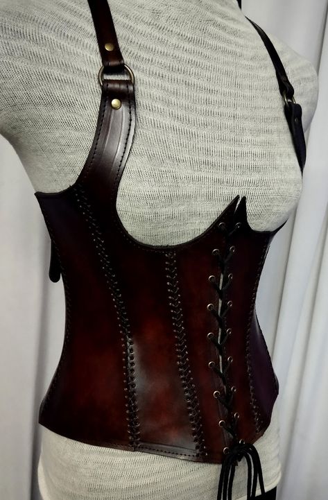 It is handmade leather Under-bust corset with hand-sewn leather detailing. It's adjustable Lace in front side and back side with buckles. We used about 2 to 2.2 mm thick handmade leather. It is hand dyed handmade leather. It is crazy for medieval events and Larp.   Corset is hand made from sturdy top-grain leather.  Bust Size is available  28 Inch to 40 inch DETAILS: ► 100% Handmade ► 100% Genuine leather ► Made on your measurements ► Unique design ► LARP standard ► Worldwide delivery Usually it Leather Corset Armor, Leather Armor Women, Corset Armor, Brown Leather Corset, Diy Goth Clothes, Medieval Corset, Steampunk Medieval, Armor Ideas, Under Bust Corset