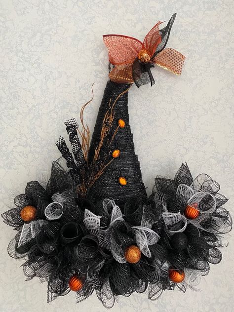 Beautiful, Black Color, 22" Mesh Wreath!! Halloween witch hat wreath with black and white deco mesh, accented with ornaments, glittery balls, spiderweb tulle, glittery curls spiders and sparkling branches because less is NOT more. Due to the handmade nature of the product, the shape, size and colors will be the same.  However the placement of the decorations will vary and the actual bling may change based on availability. Measures approximately 22"! Really full and totally whimsical. I will gladly create custom orders upon request! Just send me a message!! If you have any questions or concerns please don't hesitate to contact me The Fine Print I want you to be happy with your purchase and prefer an elated customer who will return, to a disgruntled one any day. If you have any problems or c Fall Broomstick Decor, Halloween Tulle Decorations, Spooky Halloween Wreath, Witch Wreaths, Witch Halloween Wreath, Witch Hat Wreath Diy, Grapevine Halloween Wreath, Wreaths For Fall 2024, Witches Hat Wreath Diy