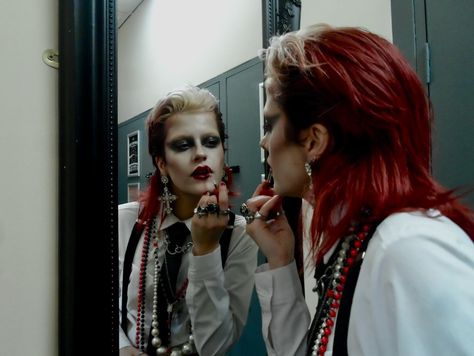 dressed to kill 📸 @gracevharper . . . . . . . . . . . #womeninsuits #blacktie #80sfashion red hair mullet wet look slicked back black tie white shirt alt alternative new wave new romantic androgynous androgyny punk goth gothic subculture 80s maximalist maximalism david bowie women in suits power suit suspenders braces chunky necklaces jewellery rings lipstick lip make up makeup mua editorial avant garde mirror pic photoshoot model modelling philosofay 80s Editorial Fashion, New Romantic Outfit, David Bowie Photoshoot, David Bowie Outfits Inspiration, Masc Punk Outfits, Black Tie White Shirt, Red Hair Mullet, 70s Goth Fashion, New Wave Outfits