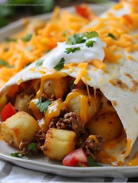 Indulge in the comforting bliss of Cheesy Potato Burritos, where golden potatoes and melting cheese unite for a symphony of flavors. It's a twist on the classic, sure to enchant! Cheesy Potato Burrito Taco Bells, Dinner Recipes Burritos, Food Truck Potatoes, Meat And Potato Burrito, Ground Beef And Potato Burritos, Cheesy Potato Burritos, Steak And Potato Burritos, Cheesy Potato Burrito, Foods Before Workout