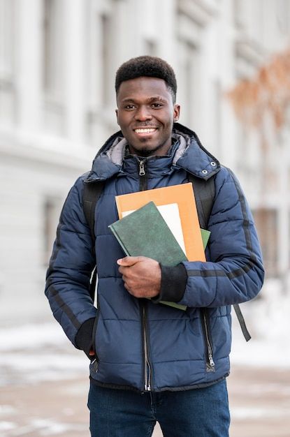 Portrait male student with books | Free Photo #Freepik #freephoto #male-student #student-man #man-portrait #male Student Self Portraits, Portfolio Design Books, Portrait Male, Student Photo, Male Teacher, Pile Of Books, Church Graphic Design, Men Photoshoot, Women Writing