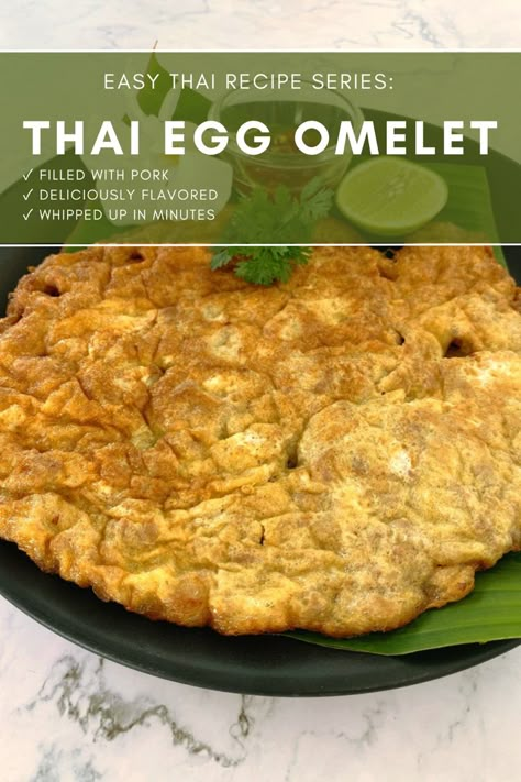 Thai egg omelet with pork on a black plate, a piece of lime, and nam prik pla a spicy dipping sauce. Thai Egg Omelet, Thai Fried Egg, Thai Egg Recipes, Thai Omelette Recipe, Thai Eggs, Thai Food Recipes Authentic, Thai Minced Pork, Yacht Food, Thai Omelette