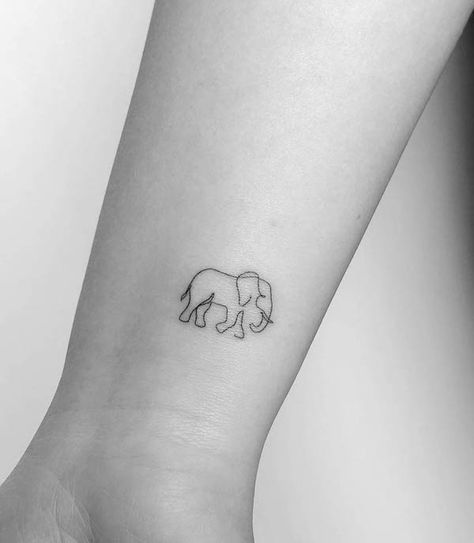 Simple elephant wrist tattoo by @mrs.tattoo Elephant Tattoos Minimal, Blue Elephant Tattoo, Mini Elephant Tattoo Simple, Elephant Alzheimer’s Tattoo, Simple Elephant Tattoos For Women, Delicate Elephant Tattoo, Single Line Elephant Tattoo, Elegant Elephant Tattoos, Elephant Tattoos Simple