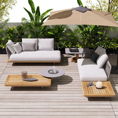 Whether you're relaxing outdoors or getting ready for a summer barbecue and neighborhood party, this three-piece seating set will keep you entertained. Made of quality materials such as teak and rattan, it features two love seats and a coffee table, all of which are weather-resistant and perfect for your outdoor area. Its sleek and modern design makes it a great addition to any outdoor area. | Latitude Run® Naphtali - Person Outdoor Seating Group blue / gray / whiteWood in Brown | 4 | Wayfair Deck Furniture Layout, Small Patio Design, Neighborhood Party, Terrace Furniture, Outdoor Patio Designs, Patio Sofa Set, Outdoor Furniture Sofa, Backyard Furniture, Outdoor Furniture Design