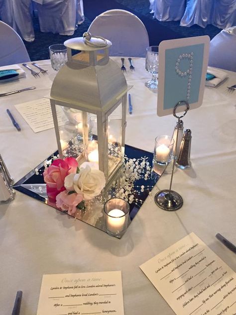 Quince Lantern Centerpiece, Lantern And Floating Candle Centerpiece, Centerpieces Using Lanterns, Aka Centerpieces, Candle Lantern Centerpieces Wedding, Moon Centerpiece Ideas, White Lantern Centerpieces, Diy Lantern Centerpieces, Wedding Table Deco