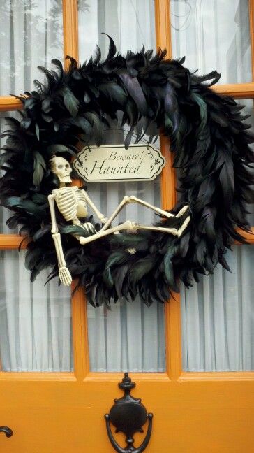 halloweenery wreath: feather wreath on clearance at jo ann's. metal sign michael's (i think). skeleton from the dollar store. Halloween Feather Wreath, Black Feather Wreath, Door Ornaments, Handmade Halloween Decorations, Door Ornament, Spooky Wreath, Fun Craft Ideas, Halloween Entertaining, Feather Wreath