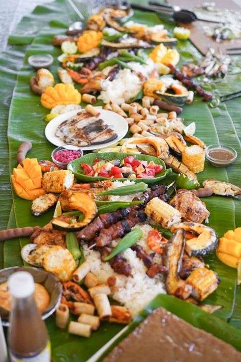 What’s a Boodle Fight or Filipino Kamayan Feast? - Hungry Huy Kamayan Feast, Filipino Food Party, Filipino Pork Bbq, Recipes Filipino, Sticky Rice Cake, Steamed Rice Cake, Fried Spring Rolls, Steamed Mussels, Roasted Chicken Thighs