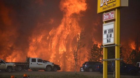 A wall of fire rages outside of Fort McMurray, Alta. Tuesday May 3, 2016. Raging forest fires whipped up by shifting winds sliced through the middle of the remote oilsands hub city of Fort McMurray Tuesday, sending tens of thousands fleeing in both directions and prompting the evacuation of the entire city. Fort Mcmurray, Wild Fire, Forest Fire, Alberta Canada, Firefighter, Fort, Around The Worlds, Forest, Instagram Photo