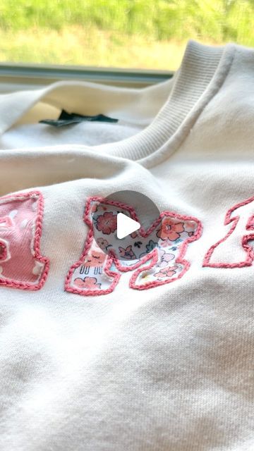 Stitchin With Samantha | Embroidery Patterns & Kits on Instagram: "Using Olive’s old newborn onesies to make a MAMA sweatshirt 🪡✨ 

I am obsessed with how this turned out and I can’t wait to wear it all the time as a keepsake for her earliest days!🥹

I have been wanting to make a onesie sweatshirt for a year now, but I was too scared to make it with a sewing machine. I was inspired by @flynn_and_mabel to try out reverse appliqué and this technique was perfect for this project!!" Mama Embroidery Sweatshirt, Reverse Embroidery Sweatshirt, Diy Mama Sweatshirt, Reverse Applique Sweatshirt Diy, Sewing On Sweatshirts, Embroidery On Sweatshirts Diy, How To Applique For Beginners, Hand Stitched Sweatshirt, Reverse Applique Sweatshirt