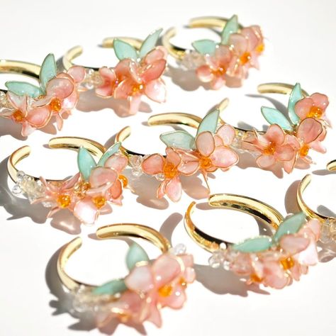 This is a handmade ring with sakura as the main theme. Each ring is unique, ensuring that each piece has high quality and exquisite details. This ring can be used not only for special occasions, but also for daily wear, allowing you to showcase your unique charm. Size:Adjustable ring Notice: There may be differences in color due to different monitors. Since it's 100% handmade customized product, we do not accept returns or exchanges. If any damage occurs during transportation, please take a photo of the damaged goods and send it to the me. I will remake and resend it for free. I accept customization and color changes. Please contact me before placing your order to note the color you want or send me a picture of the style you want to customize. Thank you for your interest in my store,Have a Sakura Ring, Petal Ring, Pearl Wedding Ring, Accessories Pearl, Fairy Ring, Bouquet Gift, Main Theme, Rings For Her, Flower Jewellery