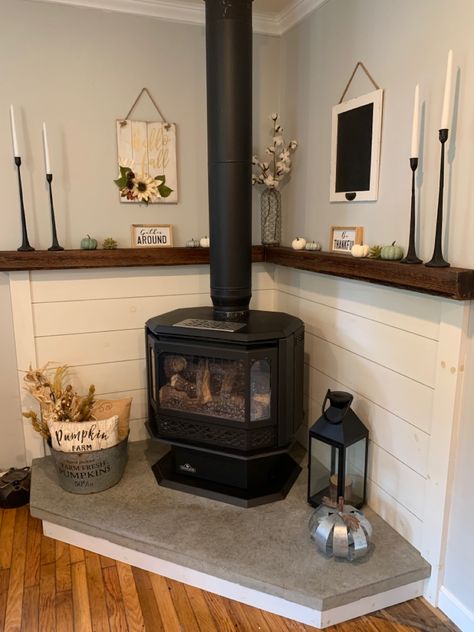 Corner Wood Stove Decor, Fireplace Stove Wood Burning, Hearth Ideas Wood Stove, Wood Stove Basement Ideas, Decor Around Pellet Stove, Behind Pellet Stove Ideas, Harth Ideas Pellet Stove, Corner Wood Stove Ideas Farmhouse, Potbelly Stove Decor Living Rooms