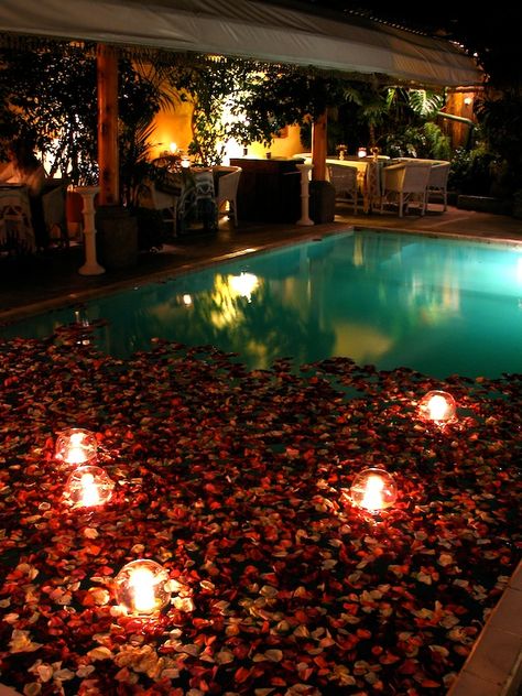 . Poolside Proposal Ideas, Hotel Room Romantic Rose Petals, Romantic Swimming Pools Night, Candle Light Bath Romantic, Candle Lit Reception Romantic, Pool Candles, Rose Pedals, Enclosed Garden, Underwater Photoshoot