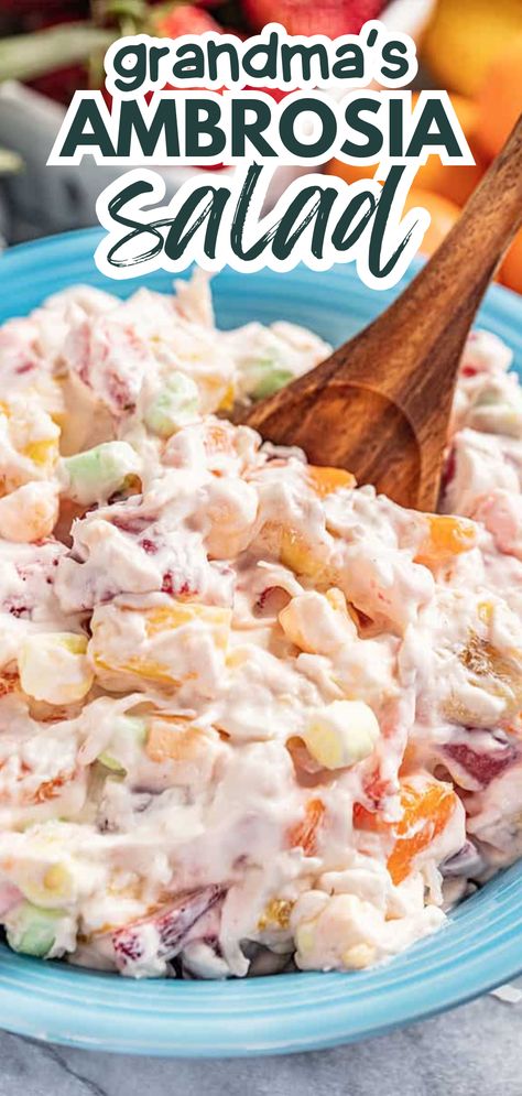 A bowl of creamy ambrosia salad. Easy Ambrosia Salad Cool Whip, Whip Cream Fruit Salad Marshmallows, Thanksgiving Marshmallow Salad, Waldorf Salad With Marshmallows, Marshmallow Fruit Salad Recipe, Marshmallow Salad Fruit, Ambrosia Fruit Salad With Cream Cheese, Waldorf Salad Recipe With Marshmallows, Ambrosia Salad With Cream Cheese