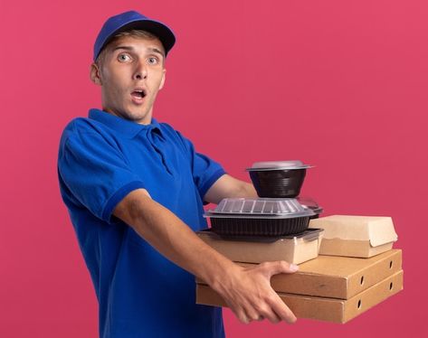 Shocked young blonde delivery boy holds ... | Free Photo #Freepik #freephoto #pizza-delivery #food-delivery #pizza-box #food-pizza Delivery Boy, Olive Green Walls, Pizza Boxes, Orange Walls, Blue Polo Shirts, Men In Uniform, Pink Walls, Red Shirt, Food Delivery