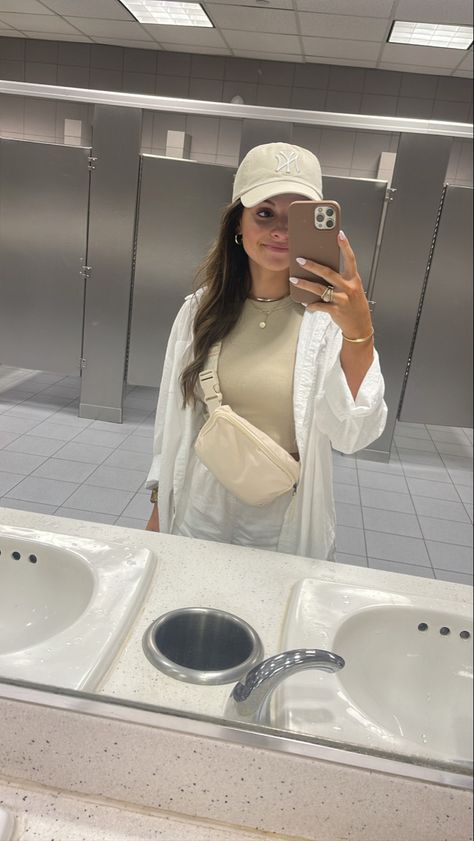 Amazon Airport Outfit. NY Yankees Hat. Beige Fanny Pack. White Coverup. White Yankees Hat Outfit, Beige Yankees Cap Outfit, Ny Yankees Hat Outfit Women, White Airport Outfit, Yankees Hat Outfit Summer, Ny Yankees Hat Outfit, Ny Hat Outfit, Beige Hat Outfit, Yankee Hat Outfits Women