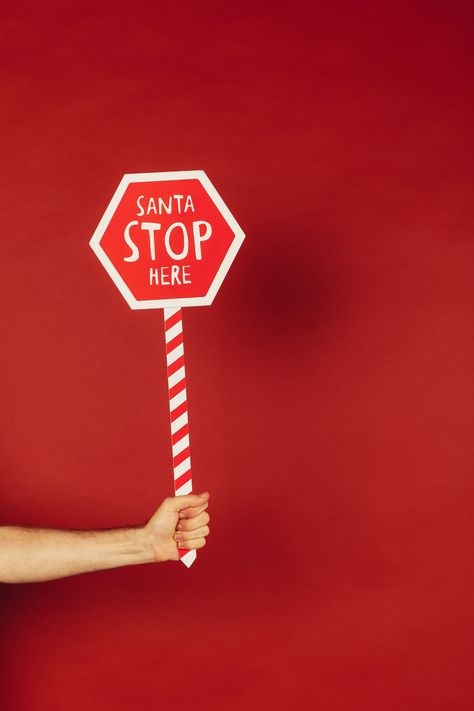 Person Holding Red and White Santa Stop Here Sign Â· Free Stock Photo, #White, #Santa, #Holding, #Person, #Red Christmas Backrounds, Santa Stop Here Sign, Airbrush App, Stop Sign, Adobe Photoshop Lightroom, Photoshop Lightroom, Red Background, Photo Editor, Christmas Decor Diy