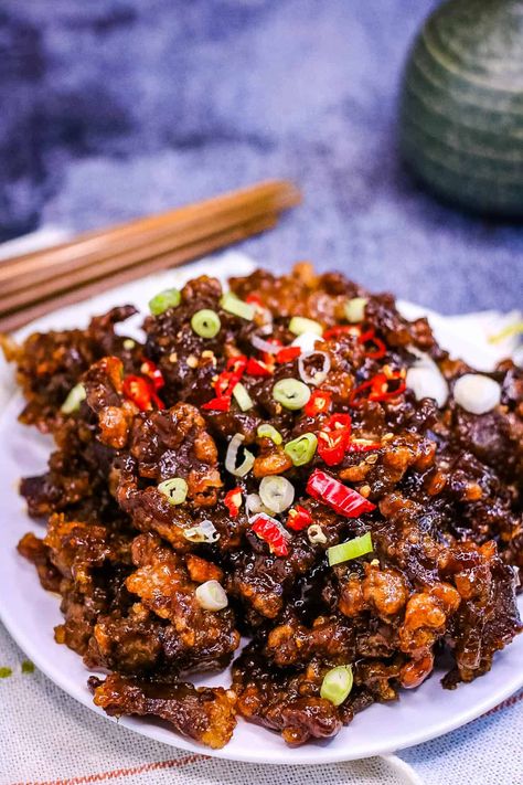 Crispy Chilli Beef is one of my favorite Chinese restaurant dishes—strips of tender beef are fried until crispy and then tossed in a sticky, sweet, spicy sauce. It’s easy to make at home, and no deep fryer is needed! Thai Food At Home, Crispy Beef Chinese, Chili Beef Recipe, Crispy Chili Beef, Chilli Beef Recipe, Sweet Spicy Sauce, Crispy Chilli Beef, Chili Beef, Asian Fusion Recipes