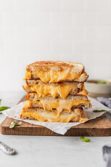 Indulge with this 4 Cheese Gourmet Garlic Grilled Cheese the next time you're craving comfort food! Easy to make and oh so delicious! Garlic butter and a parmesan crust across each slice of sourdough bread, with gooey provolone, gouda, and cheddar inside. Sandwich dream come true! | Fork in the Kitchen #forkinthekitchen #cheese #sandwich #grilledcheese Garlic Grilled Cheese, Southern Pimento Cheese, Grilled Cheese Recipes Gourmet, Burger Photography, Bagel Breakfast Sandwich, Ultimate Grilled Cheese, Gourmet Grilled Cheese, Classic Grilled Cheese, Queso Cheddar