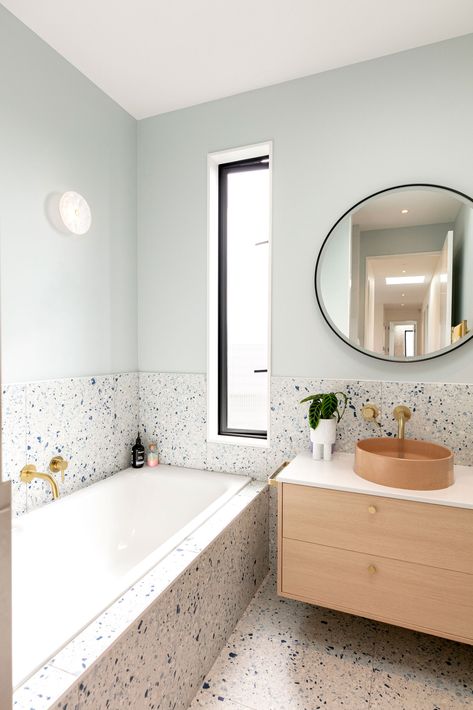 This coastal new build is a colourful dream home Terazzo Bathroom Interior Design, Terrazzo Tile Bathroom, Terrazzo Bathroom Design, Bathroom Terrazzo, Tile Around Bathtub, Terrazzo Bathroom, Blue Terrazzo, Built In Bathtub, Corner Bath