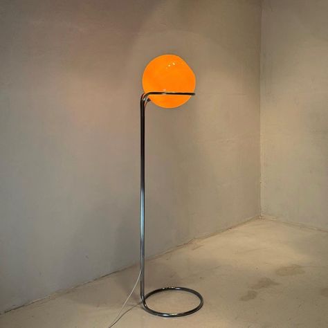 This elegant and contemporary moon light floor lamp, designed by glass artist Tibor Hazi in the 1970s Hungary, is a rare find.  The handblowb orange glass shade, set atop a sleek steel base, gives it a flooting appearence.  The lamp is in excellent condition with new wiring and foot switch.  If you are seeking a unique piece that's hard to come by, this would be the perfect addition to your space.   Light source : E27 edison screw fitting max 60W.  Size : 142cm / 55.9" high and 35cm / 13.8" wide Floor Lamp Scandinavian, Orange Floor Lamp, Unique Floor Lamp, Funky Floor Lamp, Funky Floor Lamps, Retro Floor Lamps, Funky Lamps, Unique Floor Lamps, Floor Lamps Living Room