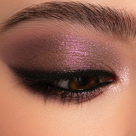 Lose yourself in this wondrous mix of 9 matte eyeshadows, shimmer eyeshadows, metallic eyeshadows and duochrome eyeshadows. A dreamscape of beauty, this travel-friendly eyeshadow palette with purple and mauve shades will let you create flawless looks that mesmerize. HOW TO USE With a fluffy eye brush, softly apply the transition eyeshadow shade of your choice to your crease. Then, with a shader brush, pick up the next shade of your choice and sweep it across the lid. To ensure your look is seaml Plum Eye Makeup Brown Eyes, Day And Night Makeup Looks, Purple Eye Makeup For Brown Eyes, Plum Dress Makeup, Morphe 35xo Palette Looks, Purple Shimmer Eye Makeup, Dark Purple Smokey Eye, Subtle Purple Eyeshadow, Eye Makeup For Wedding Guest