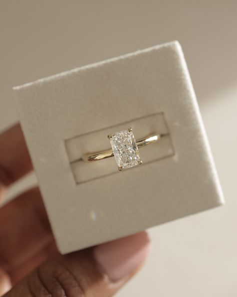 Crushing on this elongated cushion solitaire...🤍⁠ ⁠ The elongated cushion cut is all about elegance, with its unique flair of rounded corners resembling a pillow.   The perfect blend of timelessness and statement✨⁠ ⁠  Details: Ava Elongated Cushion Solitaire Low set 1.54cts | F | VS1 Elongated Cushion Carat Comparison, Elongated Princess Cut Engagement Ring, Square Diamond Gold Band Engagement Ring, Unique Engagement Rings Rectangle, Old Mine Cut Elongated Cushion, Elongated Cushion Engagement Ring Thick Band, Rectangle Cushion Engagement Ring, Enlogated Cushion Ring, Elongated Cushion Vs Radiant