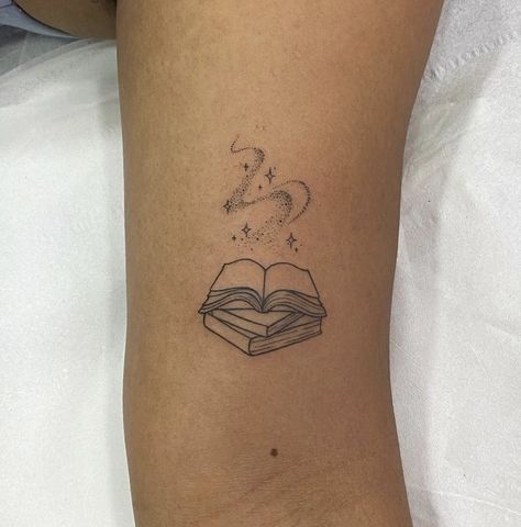 Tattoo About Magic, Book Tattoo Small Simple, Fine Line Date Tattoo Ideas, Tiny Tattoos Book, Books Tattoo Minimalist, Mother Daughter Book Tattoos, Book Magic Tattoo, Harry Potter Book Tattoo Ideas, Book Reader Tattoo