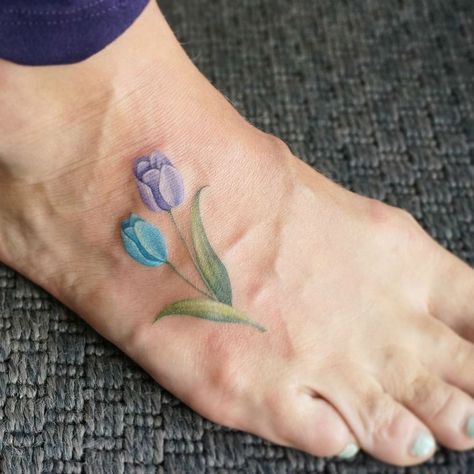 17 Fine Line Pastel Tattoos by G. No Tiny Tulip Tattoo, Pastel Tattoos, Watercolor Flower Tattoo, Tulip Tattoos, Pastel Tattoo, Tiny Watercolor, Famous Tattoo Artists, Tulip Tattoo, Stylish Tattoo