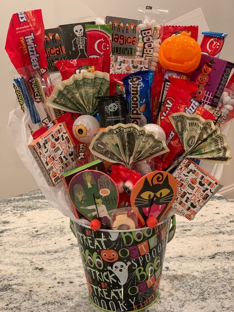 Candy, small toys and stickers bouquet. The basket makes a great gift for Halloween, Birthday, get well , thank you, teacher and/ or any other occasion. Items , themes and price may vary for special requests. **PLEASE NOTE - Contents may contain nuts or may be produced near nut products.* Small Basket Ideas, Money And Candy Bouquet, Toy Centerpieces, Goodie Basket Ideas, 21st Birthday Basket For Guys, Gift Basket Decorating Ideas, Halloween Baskets For Adults, Cute Birthday Baskets, Small Candy Bouquet