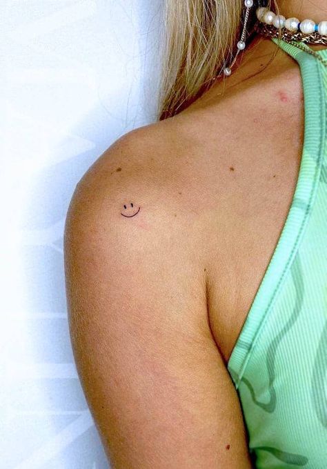 Smiley Face Small Tattoo, Tiny Front Shoulder Tattoo, Tiny Tattoo On Shoulder, Smiley Face Knee Tattoo, Dainty Smiley Face Tattoo, Tiny Smiley Tattoo, Happy Small Tattoos, Simple Smiley Face Tattoo, Shoulder Tiny Tattoo