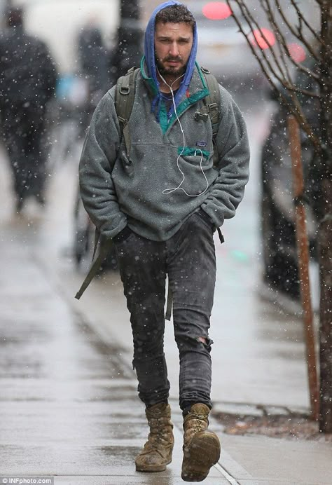 With snow settling on his hair, the celebrity layered up in a thick grey fleece over a blu... Shia Labeouf Style, Stylish Picture, Rat Tail, Jonathan Rhys Meyers, Shia Labeouf, Army Boots, Eyebrow Ring, Jeremy Renner, Bradley Cooper