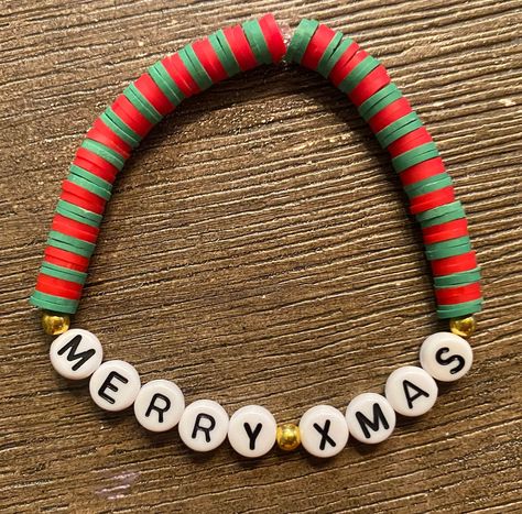 A Red and green beaded bracelet that says "Merry Xmas" Perfect Christmas gift!  Fits small wrists (teens, young adults, older kids) Xmas Bracelets Clay Beads, Holiday Bracelet Ideas, Friendship Bracelets Christmas, Christmas Clay Bead Bracelet Ideas, Green Bracelet Ideas, Xmas Bracelets, Handmade Jewelry Display, Holiday Bracelets, Bracelet Inspiration