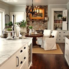 A Winter Farmhouse | The Everyday Home | www.everydayhomeblog.com Benjamin Moore, White Cabinets, Benjamin Moore Gray, Brick Fireplace, Counter Tops, Küchen Design, Banquette, Breakfast Room, Beautiful Kitchens