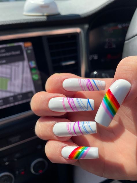 A hand showing nails, the thumb and pinky have a diagonal strip of rainbows and the middle three fingers are white with blue purple and pink lines going horizontally across the nails Pride Coffin Nails, Nails Coffin Square, Bi Pride Nails, Pride Nails, Flag Nails, Bi Flag, Long Acrylic Nails Coffin, Long Acrylic, Rainbow Nails