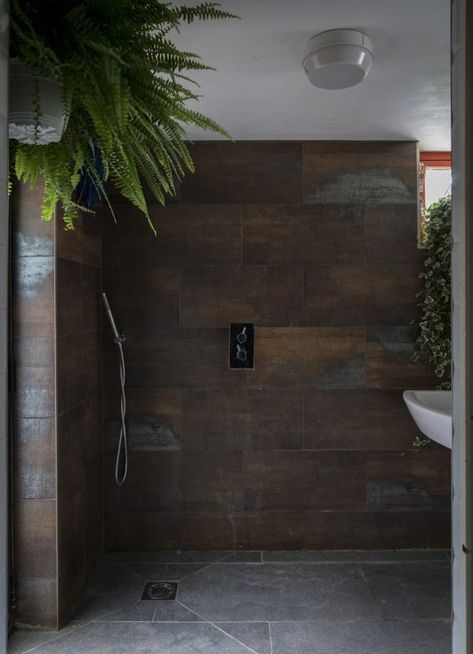 Corten Bathroom Design, Bronze Tile Bathroom, Industrial Chic Bathroom Ideas, Bronze Bathroom Tiles, Dark Tiled Shower Ideas, Industrial Chic Bathroom, Gothic London, Antique Bathroom Ideas, Moody Industrial