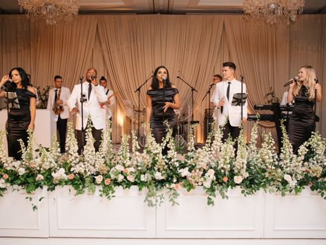 Wedding Ballroom Decorations Receptions, Wedding Band Stage Florals, Wedding Band Stage Backdrop, Wedding Band Backdrop Ideas, Stage Florals Wedding, Stage Flowers Wedding, Wedding Band Stage Flowers, Band Backdrop Wedding, Wedding Stage Flowers