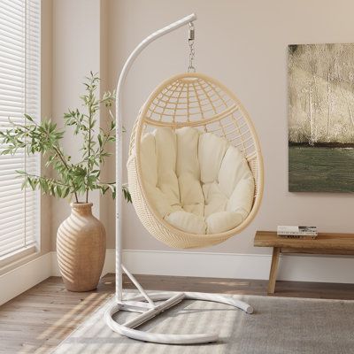 Comfortable Swing egg chair for Indoor, Outdoor, Garden, and Porch. The chair accommodates up to 330 lbs. and the hammock egg chair is suspended by a metal chain. With 10 levels of height adjustment, suitable for ages ranging from kids to adults. Cushion Color: Ivory, Frame Color: White/Natural | Bayou Breeze Arcella 1 Person Hanging Porch Swing Egg Chair w / Stand & Cushion 330lb Capacity 76.8 H x 33.9 W x 36.8 D in grayPlastic | 78" H X 34" W X 37" L;78" H X 34" W X 37" L | Wayfair Hanging Egg Chair, Garden Porch, Swing Chair, Cute Room Ideas, Egg Chair, Girl Mom, Swinging Chair, Porch Swing, Color Ivory