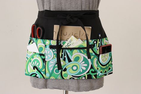 Servers should have original half aprons like this: base is black with colorful (the business colors)  and lots of pockets, some with zipper. Perhaps a bit longer than this apron (como el que vimos en PaloAltoMarket) Half Aprons With Pockets, Aprons Diy, Gardening Aprons, Teachers Apron, Vendor Apron, Apron Pattern Free, Half Aprons, Waitress Apron, Teacher Apron