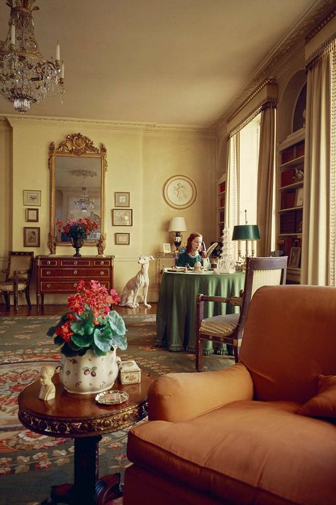 This spacious stuccoed London house belonged to the politician John Profumo and his wife, the actress Valerie Hobson. Its traditional decoration shows a different side to the Sixties - of opulent interiors firmly rooted in the past. Here Valierie sits behind her desk. The French hound in the background is made from white faience. Like this? Then you'll love [link url="http://www.houseandgarden.co.uk/interiors/decoration/schemes/brown-furniture"]It's time to embrace brown furniture! How to use London House Interior, 1960s Living Room, 1960s Interior, Kensington House, Barbara Hulanicki, 60s House, 60s Interior, 1960s Home Decor, Townhouse Interior