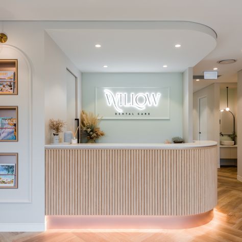 Dental Surgery Design Interiors, Calming Waiting Room, Aesthetic Dental Office, Receptionist Aesthetic Clinic, Womens Health Clinic Design, Industrial Dental Clinic Design, Neutral Pastel Aesthetic, Pastel Office Interior, Modern Dental Office Design Waiting Rooms