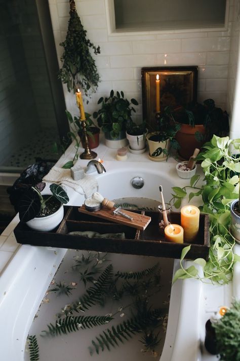 A dreamy bath surrounded by green plants. A wooden board crosses the tub filled with candles, more plants, a butterfly safety razor, and a shaving brush. The photo is moody, dark, and dreamy. Bath Aesthetic, Beeswax Pillar Candles, Spiritual Bath, Dream Bath, Relaxing Bath, Dream Apartment, Dream Bathroom, Dream House Decor, Bathroom Inspiration