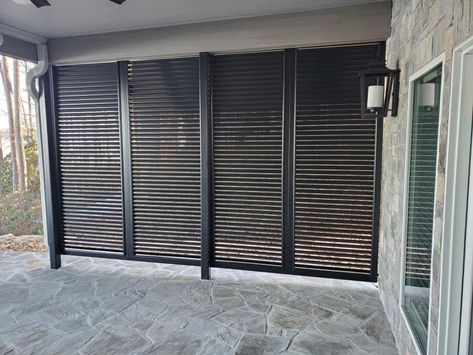 This is my best kept secret for privacy. 🤫 Bahama shutters can be customized into louvered walls for your home! I know right? Your mind is blown. 🤯 The best part? If a Bahama shutter isn't exactly the right fit your home, there's a chance a louvered wall might be! You have a patio, a porch, or a lower level like this? This is a privacy solution you have to consider. SAVE + SHARE this for future use. Louvered Outdoor Wall, Louvre Shutters Exterior, Exterior Louvered Shutters, Louvered Wall, Bahamian Shutters, Louver Design, Raised Homes, Louvered Shutters Lowe's, Shutter Wall