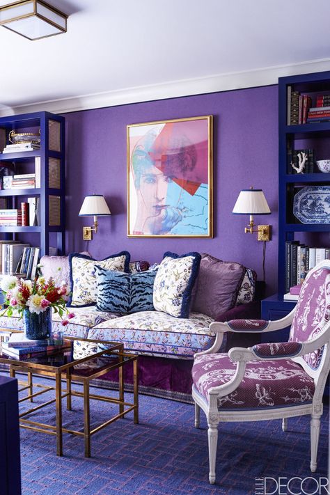 In the library of the Upper East Side apartment Alex Papachristidis designed for Samantha Rudin Earls and David Earls, the custom sofa is upholstered in a Manuel Canovas velvet with cushions in a Brunschwig & Fils cotton; the Louis XVI armchair is covered in a Braquenié fabric, the custom carpet is by Beauvais, the print is by Andy Warhol, and the walls are sheathed in a Manuel Canovas lambswool. Purple Interior Design, Design Ložnic, Purple Room Decor, Purple Wall Decor, Purple Living Room, Interior Design Minimalist, Purple Interior, Purple Rooms, Pink Fairy