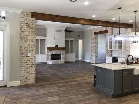 Brick Arch Into Kitchen, Brick Kitchen Entryway, Exposed Brick Column Kitchen, Brick Between Kitchen And Living Room, Brick Interior Columns, Brick Opening To Kitchen, Brick Farmhouse Interior, Brick And Beam Interior, Brick Archway In Kitchen Wood Beams