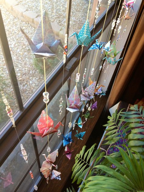 Origami Wind Chimes, Paper Cranes Decor, Paper Strings Decor, Paper Crane Decoration Bedroom, Paper Crane Crafts, Paper Crane Room Decor, Paper Crane Ceiling, Paper Crane Decoration, Paper Crane Chain