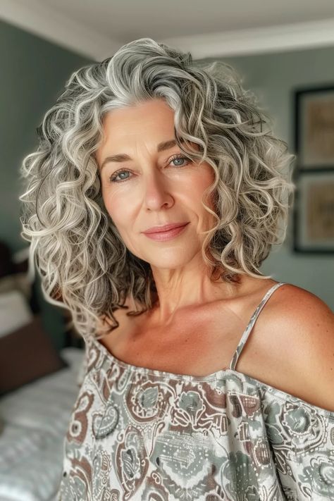 40 Grey Curly Hair Hairstyles to Highlight Your Best Features Growing Out Grey Hair Styles, Medium Length Curly Gray Hair, Curly Grey Hair Over 50, Grey Curly Hair Over 50, Growing Out Curly Hair, Curly Gray Hair Over 50, Gray Curly Hair Natural Curls, Short Curly Grey Hair, Curly Gray Hair Over 50 Curls