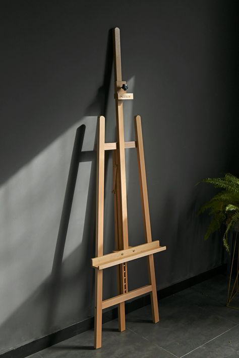 Size & flexibility. Extra large Lyre style studio A-frame wooden easel which could be adjusted from 68.9" to 88.2" in height. Different from the classic one, the canvas stand can hold canvas up to 49.6". According to the needs of different customers, we designed the overall angle adjustment and the canvas part adjustment. You can adjust the rear leg and upper knob to reach the angles you want. Quality & Stability. This art easel stand is made of strong beech wood with metal accessories, which is Diy Wood Easel Stand, Easel Drawing, Canvas Stand, Painting Easel, Floor Easel, Floor Painting, Artist Easel, Wood Easel, Print Design Art