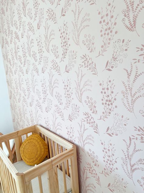 Nursery Wall Stencil Ideas, Flower Stencil For Wall, Pink And White Stencil Wall, Stenciled Nursery Wall, Stencil Nursery Wall, Nursery Accent Wall Wallpaper, Toddler Accent Wall Girl, Toddler Girl Room Accent Wall, Baby Girl Accent Wall Nursery